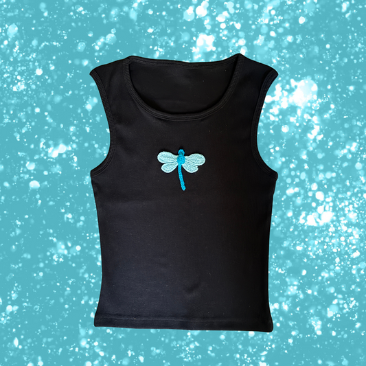 Black sleeveless shirt with a blue dragonfly design on a blue background with white specks, branded 'Carnation'.